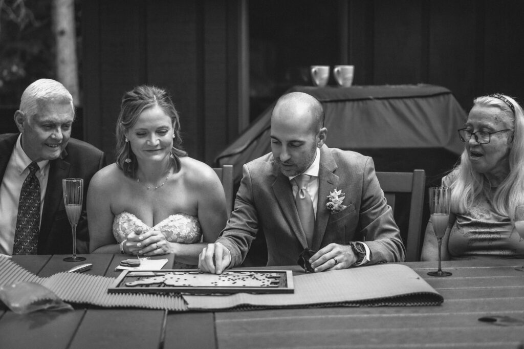bride and groom receive a gift from family