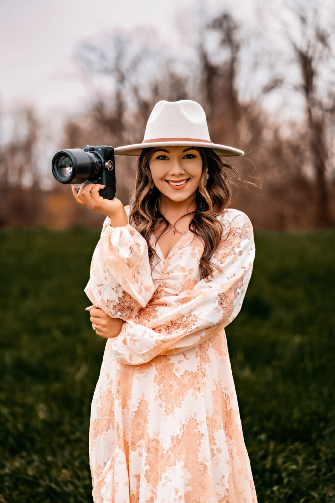 Emily Belanger holding a camera