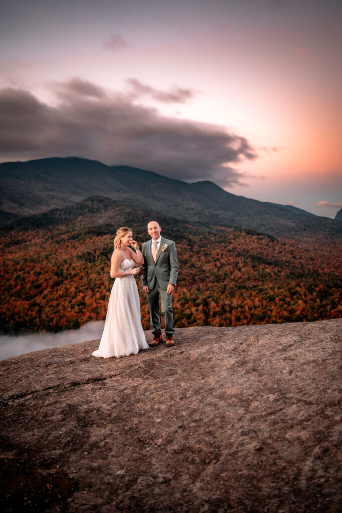 Bride and Groom share a moment when a group of hikers cheer them on when they finish their vows.