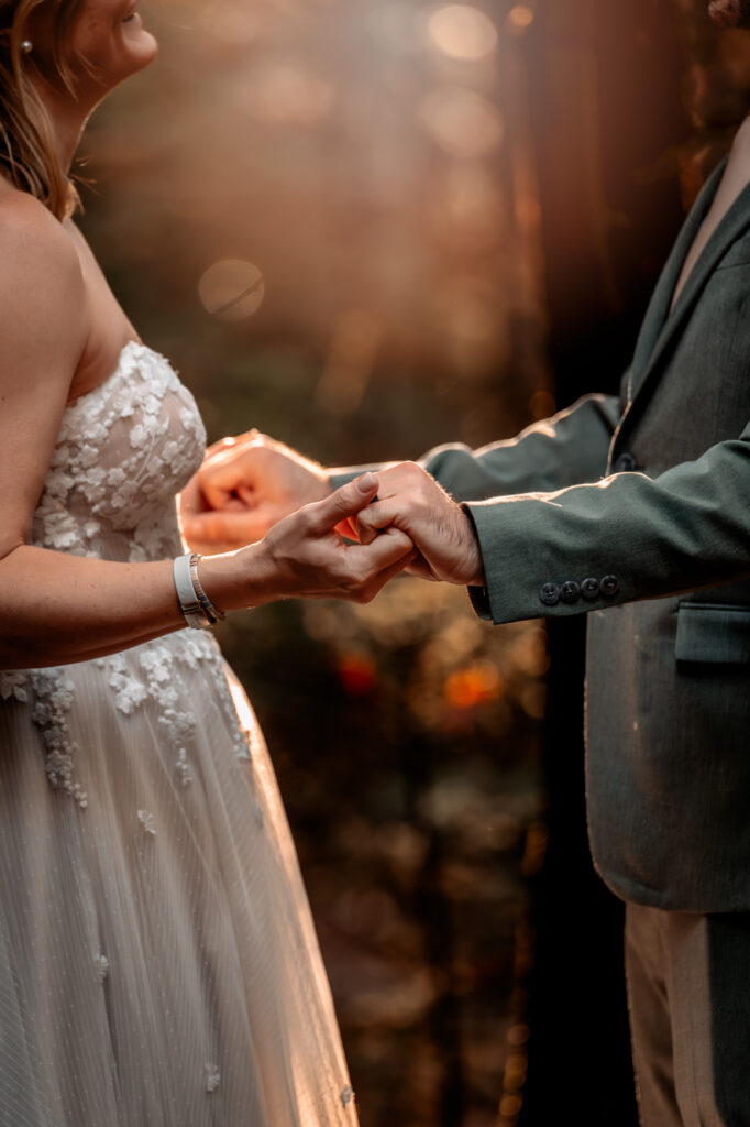 bride and groom holding hands