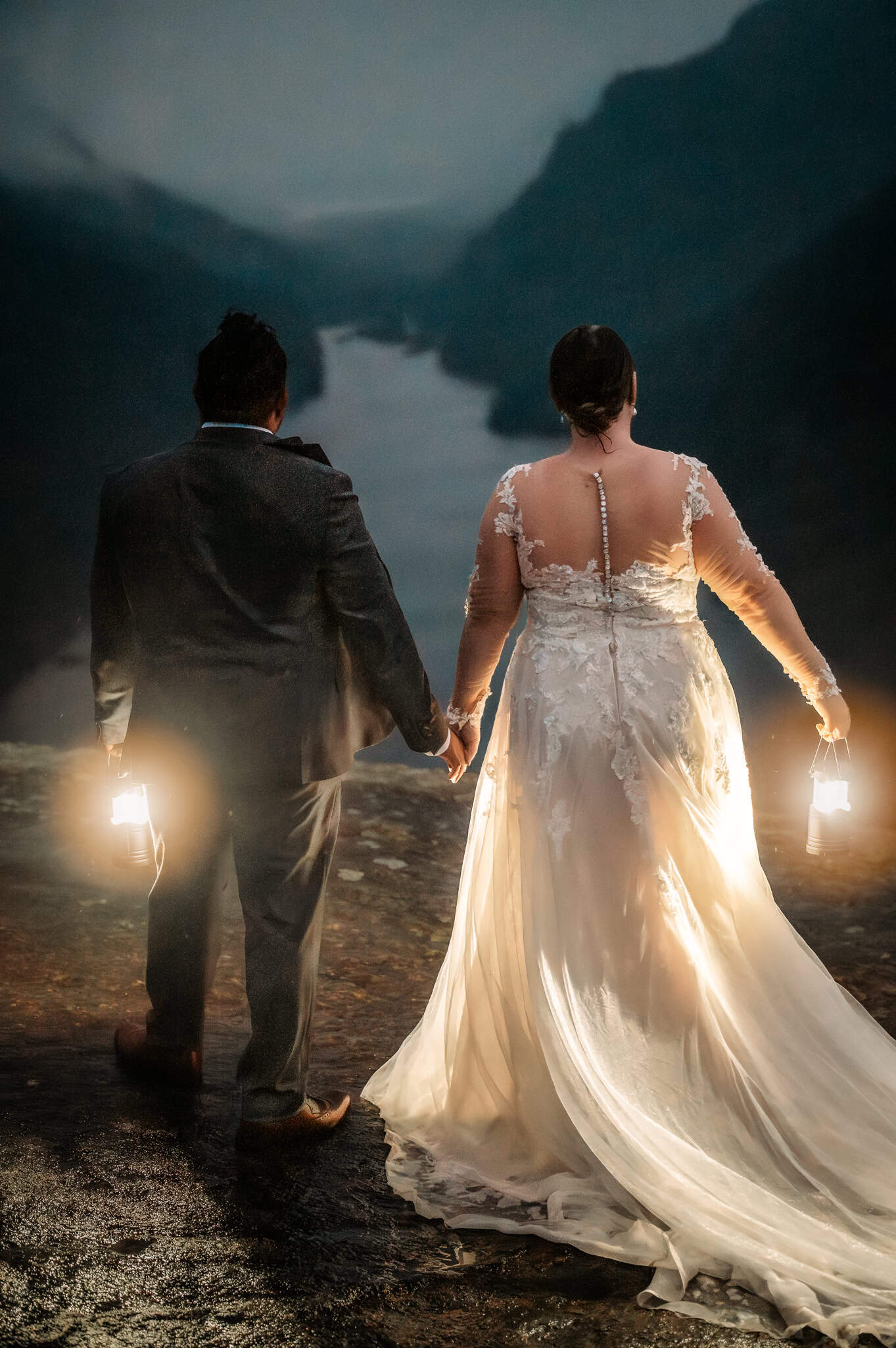 Couple Elopes on Indian Head mountain with lanterns in the rain.