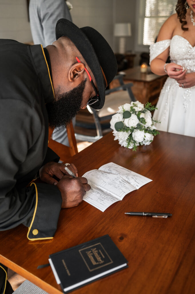 A pastor signs marriage license for a couple who just eloped in new york.