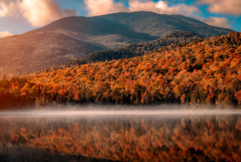 sunrise on heart lake in the adirondack mountains in the fall.