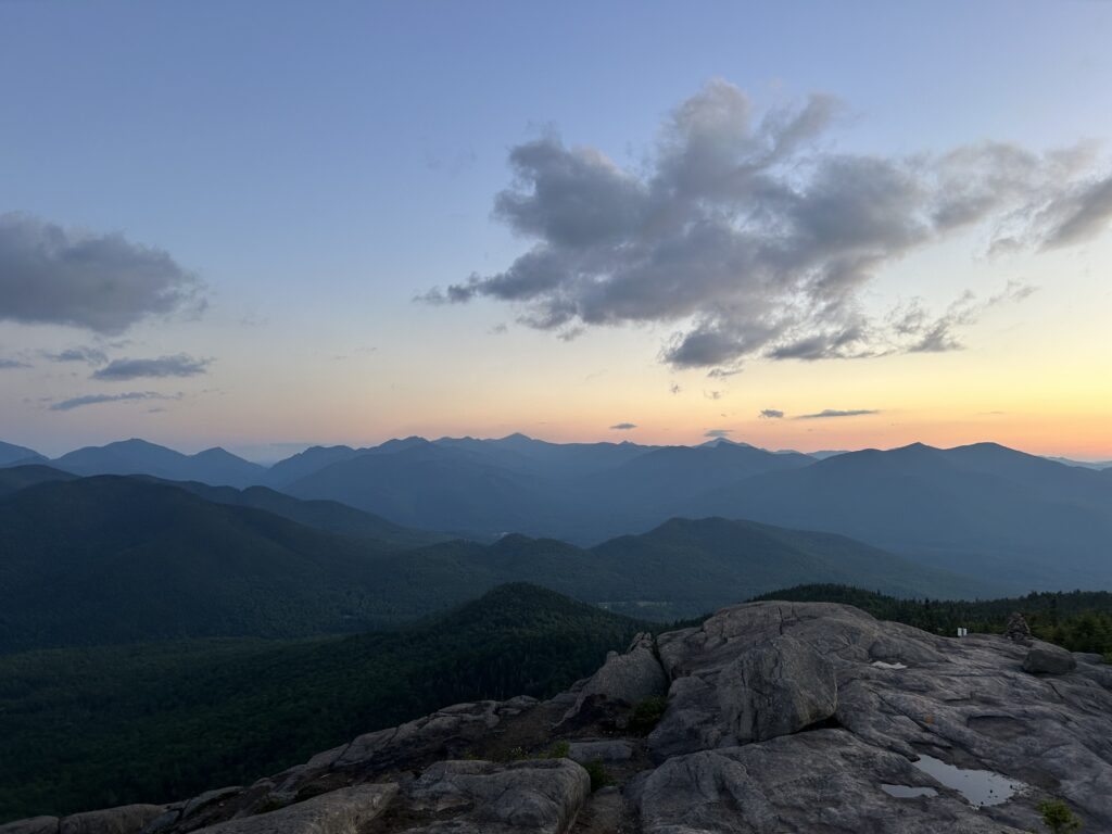 A large summit at sunset in the Adirondack Mountains.
