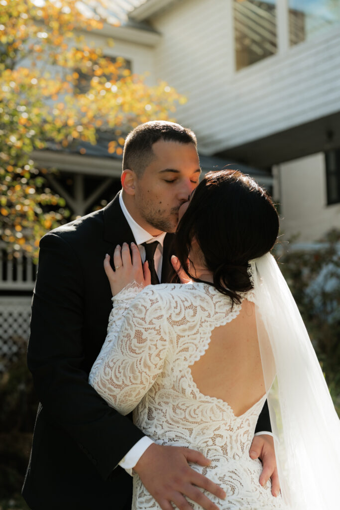 A couple kisses in the sun